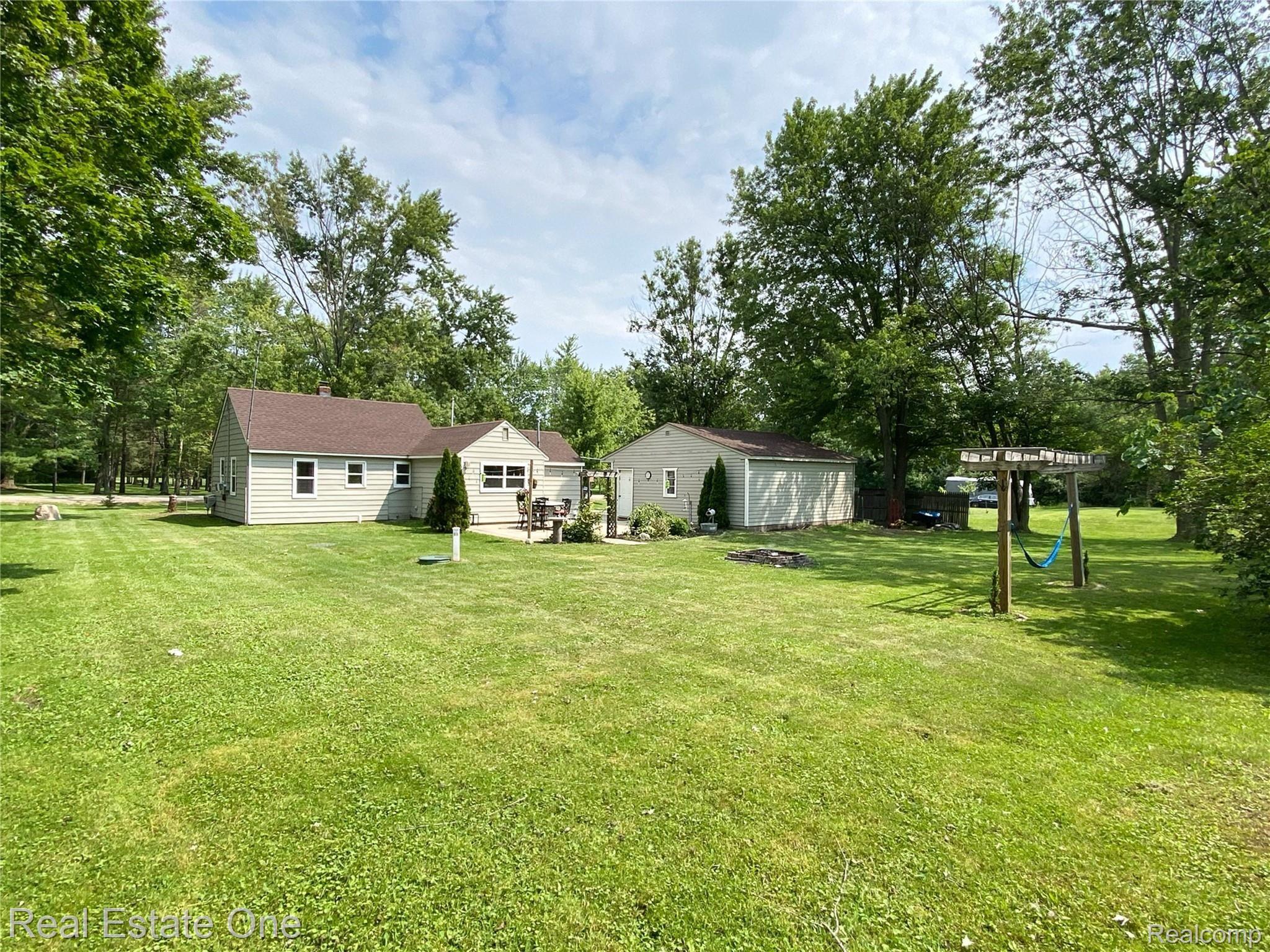 487 Henderson Road Howell, MI 48855 - Photo 26 of 27 Situated among Mature Trees