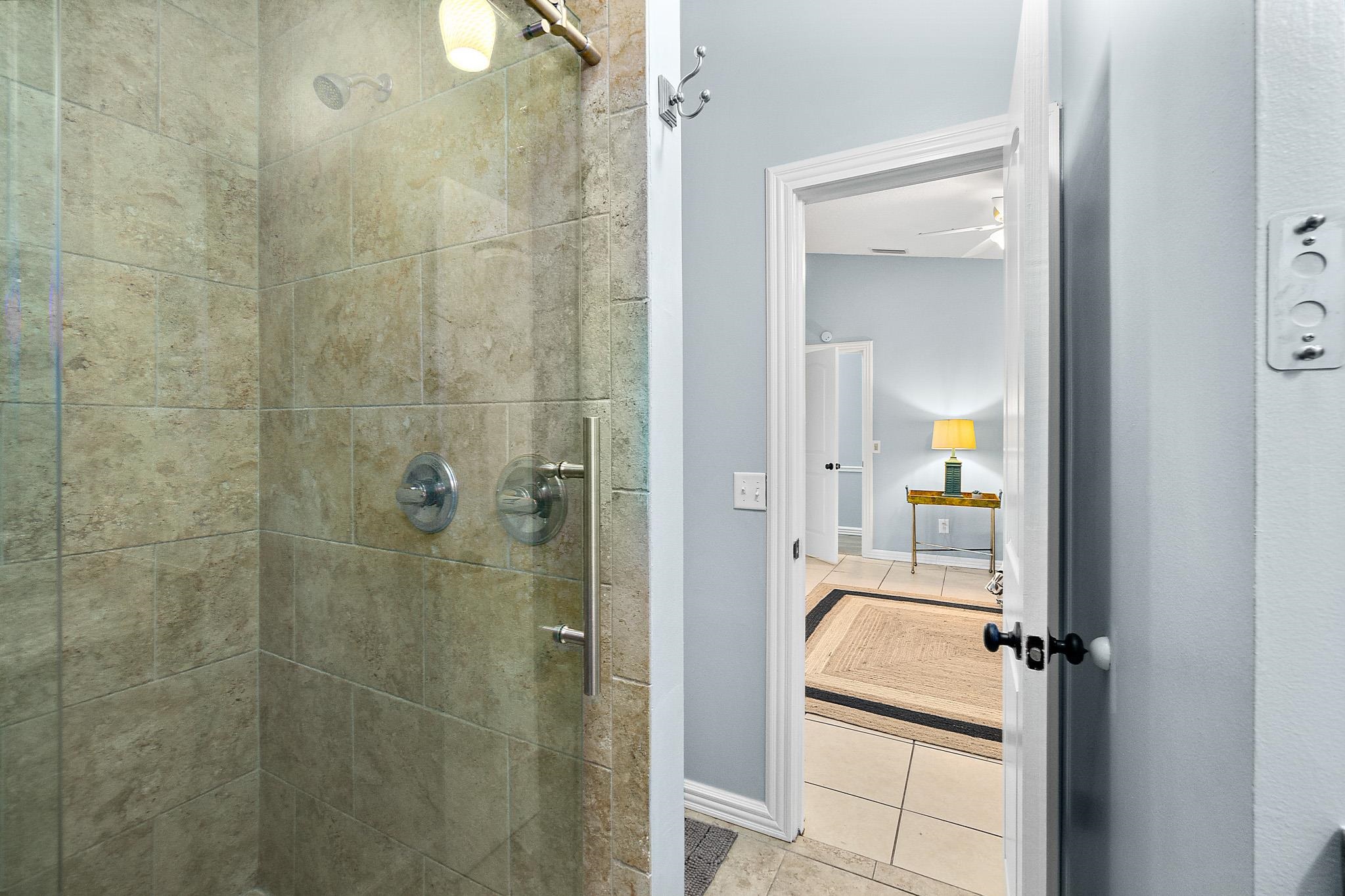 133 Gentian Road St. Augustine, FL 32086 - Photo 26 of 40 a en suite bathroom with a granite countertop shower a sink and a mirror