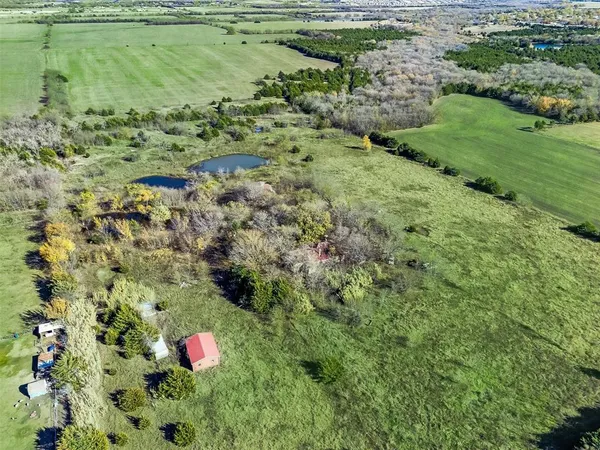 a view of a garden with a pond