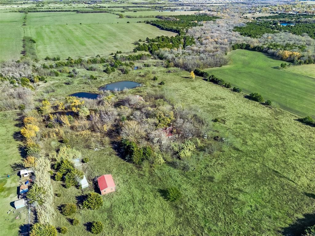 1851 Stainback Road Ferris, TX 75125 - Photo 2 of 8 a view of a garden with a pond