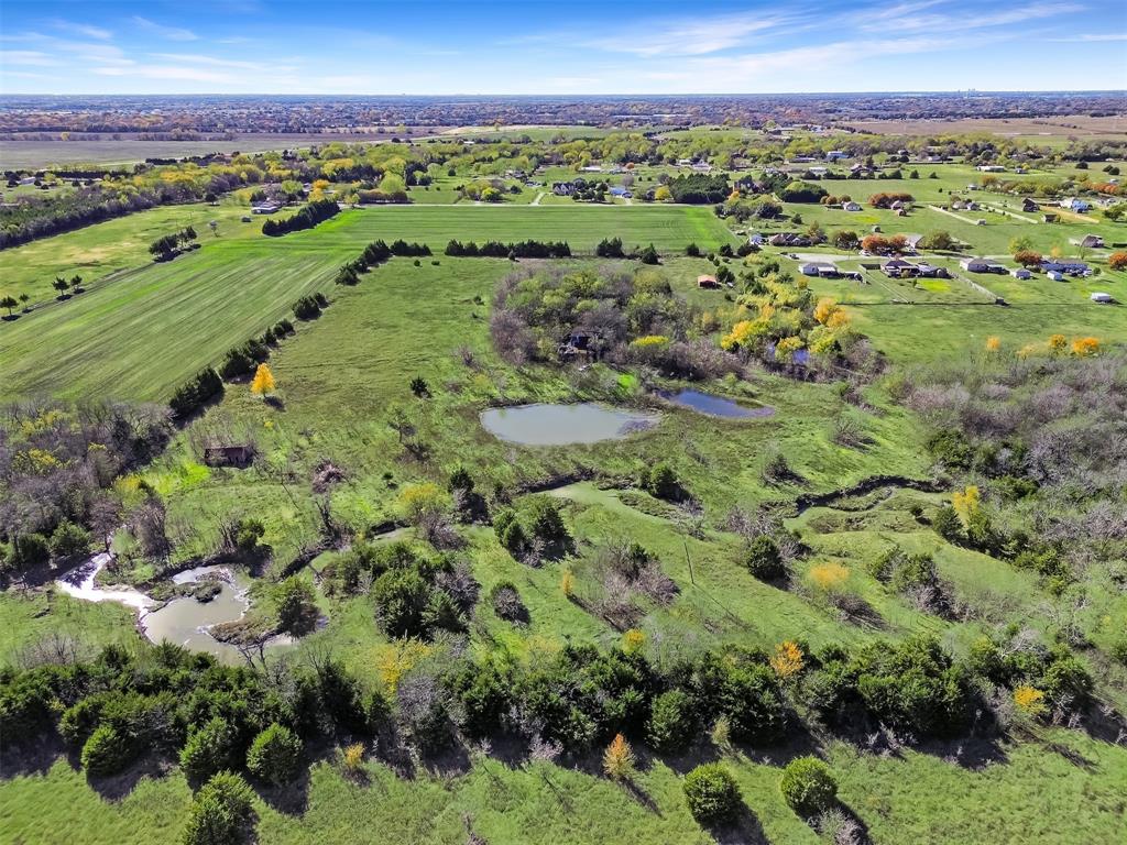 1851 Stainback Road Ferris, TX 75125 - Photo 6 of 8 a view of a city with lush green forest