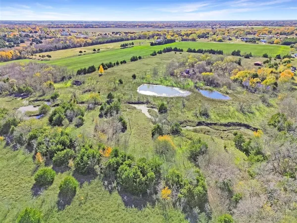 a view of a city with green space