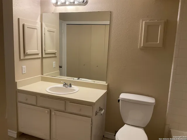 a bathroom with a toilet sink and bathtub