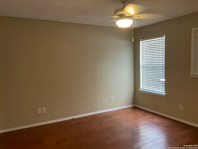 an empty room with closet area