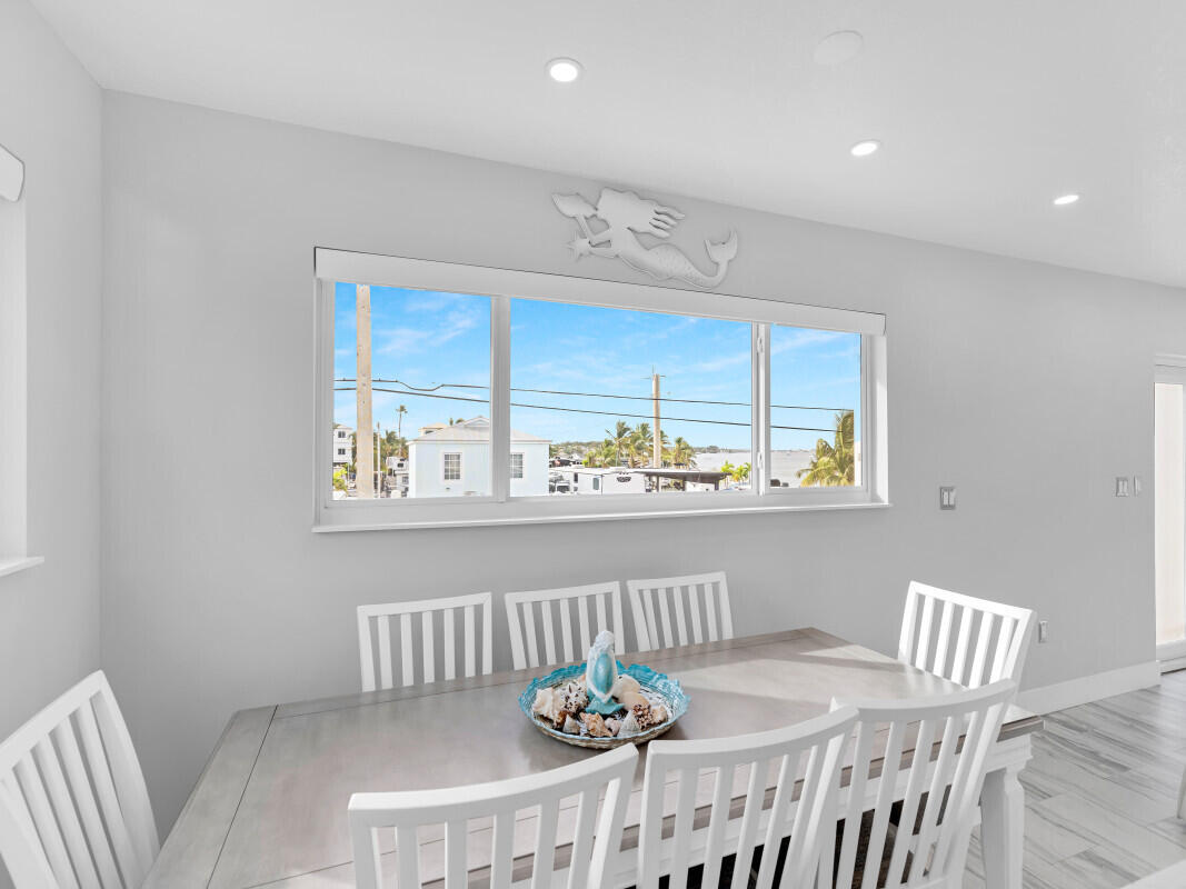 325 Calusa Street, Unit 359 Key Largo, FL 33037 - Photo 7 of 52 a view of a dining room with furniture window and outside view