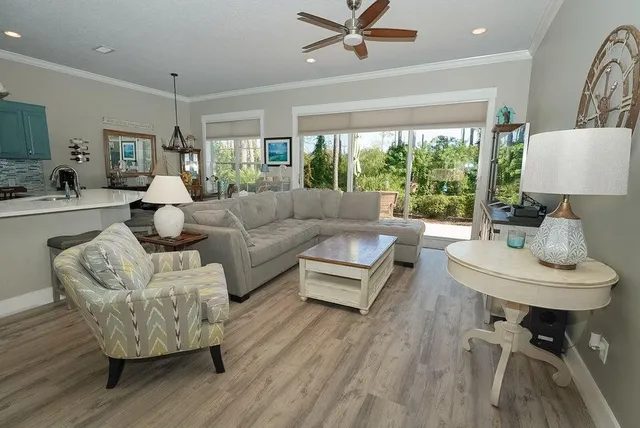 a kitchen with stainless steel appliances granite countertop wooden cabinets a sink dishwasher a stove and a refrigerator