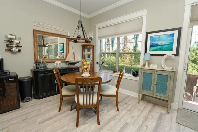 a large kitchen with lots of counter space and furniture