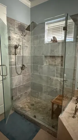 a white toilet sitting next to a shower curtain