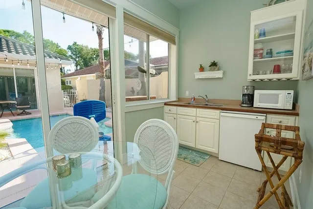 a living room with a large window and furniture