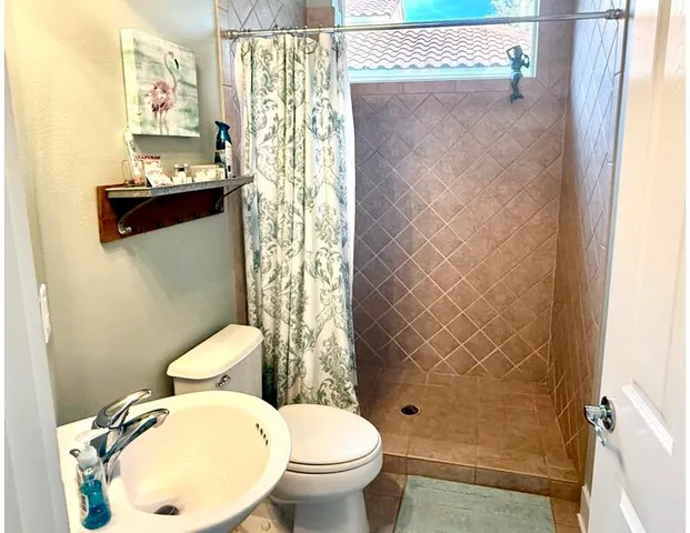 a view of a hallway with a wooden floor