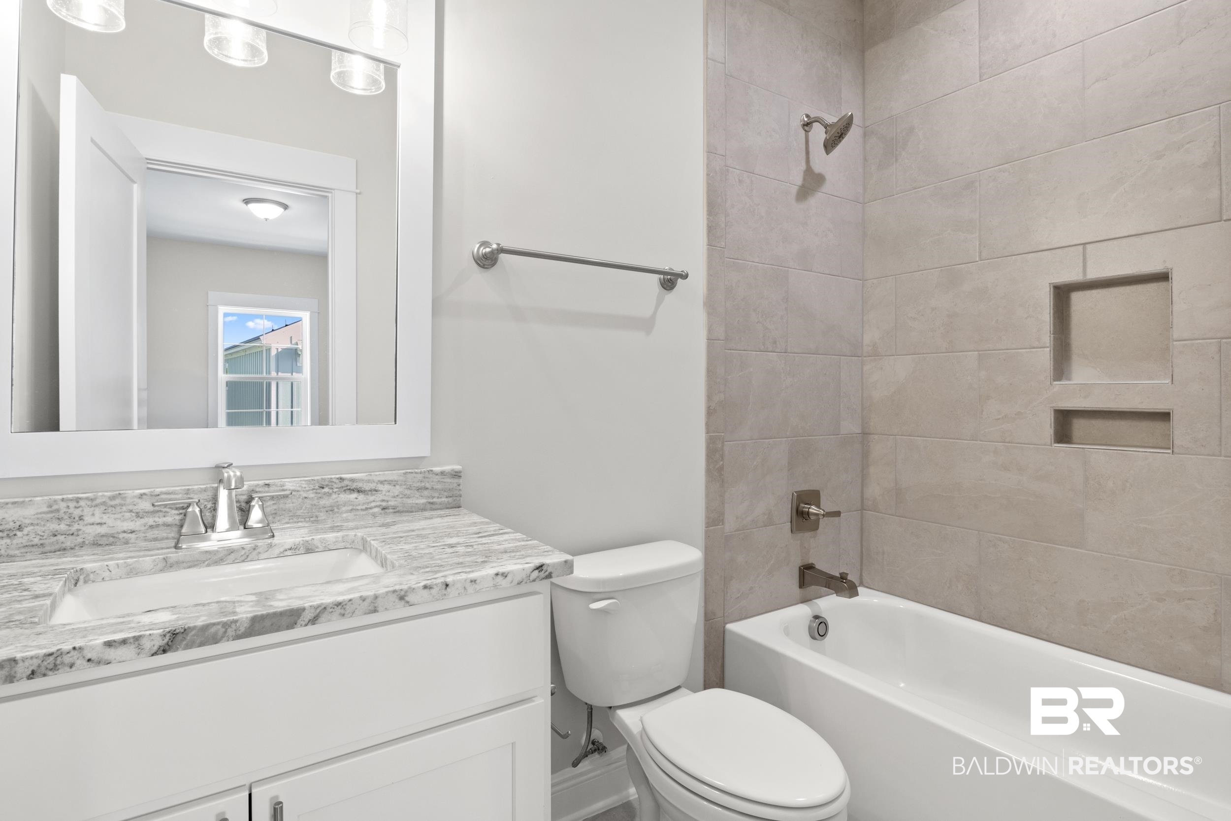 2847 Salt Drive Orange Beach, AL 36561 - Photo 20 of 29 Full bathroom featuring vanity, tiled shower / bath combo, and toilet