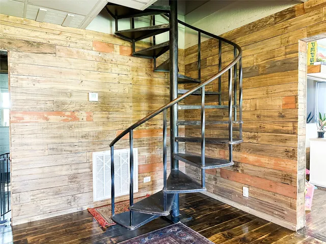 a balcony view with a glass door