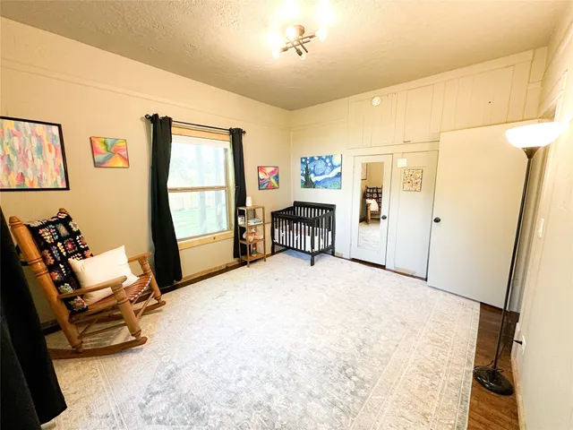 a view of a livingroom with furniture and a window