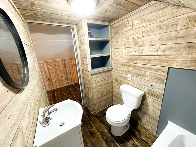 a bathroom with a toilet and a sink