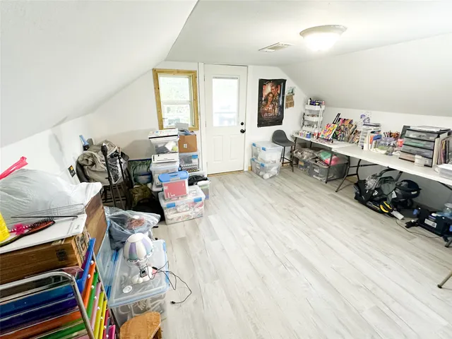 a room with furniture and a wooden floor