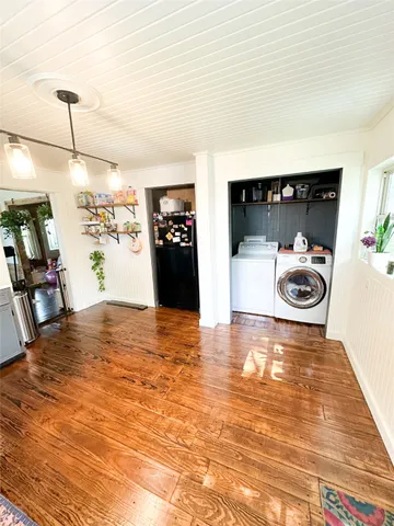 a view of a living room and kitchen