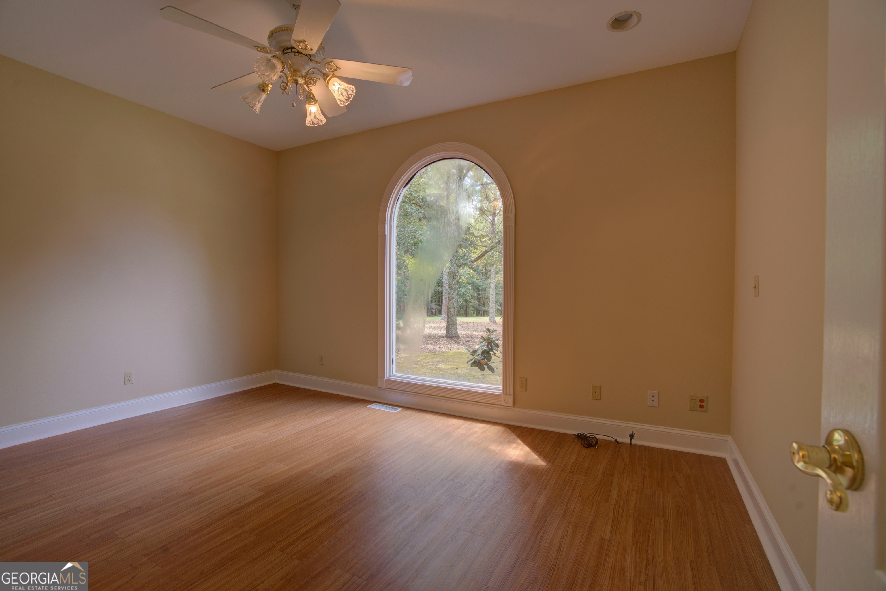2011 Bailey Road Aragon, GA 30104 - Photo 23 of 66 an empty room with wooden floor fan and windows
