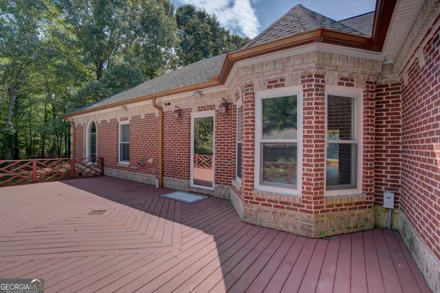 a kitchen with a sink appliances cabinets and a window
