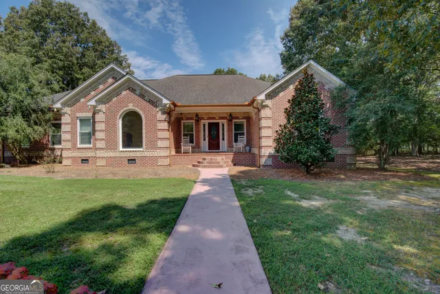 a view of living room filled with furniture and a chandelier