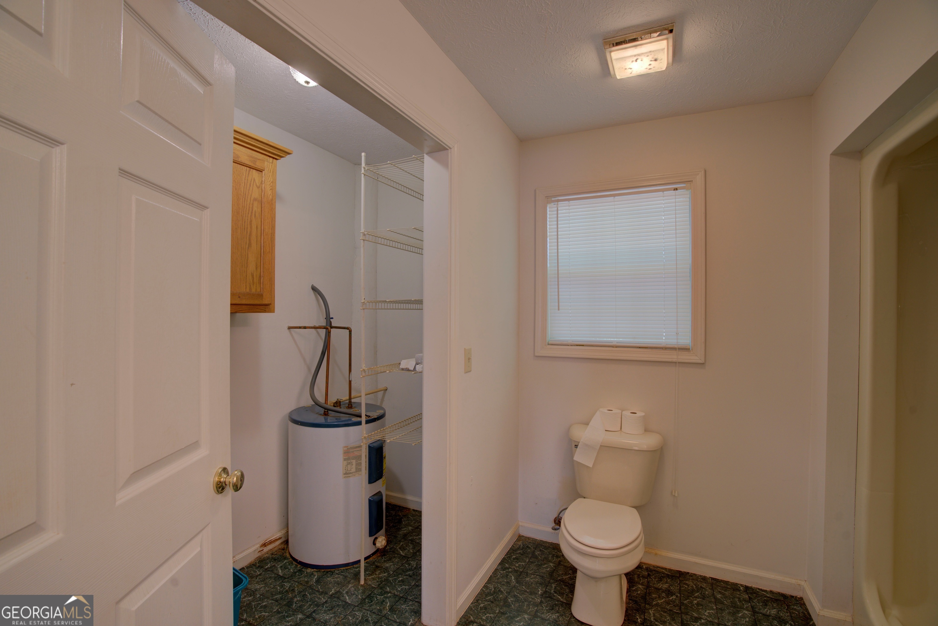 2011 Bailey Road Aragon, GA 30104 - Photo 49 of 66 a bathroom with a toilet and a sink