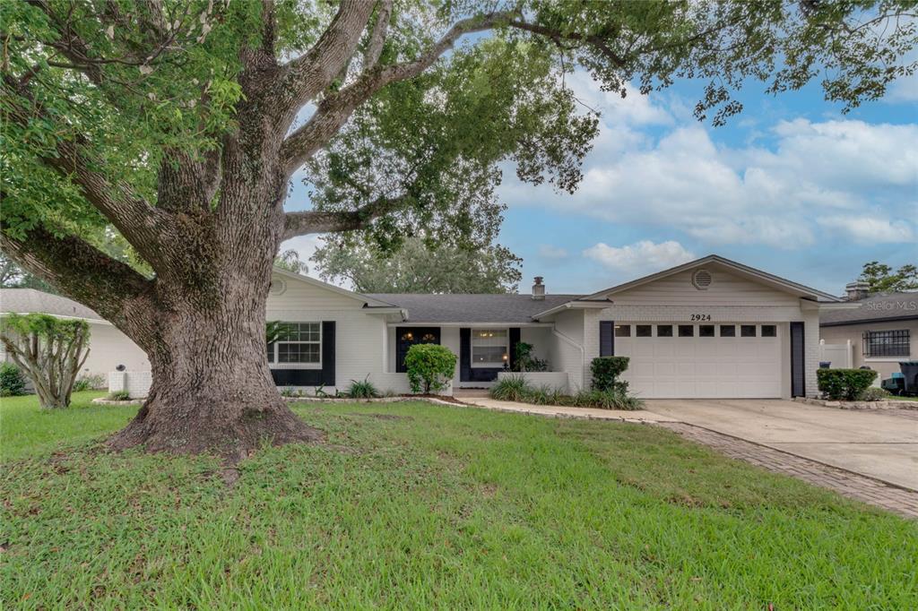 2924 Scarlet Road Winter Park, FL 32792 - Photo 1 of 1 a front view of house with yard and green space