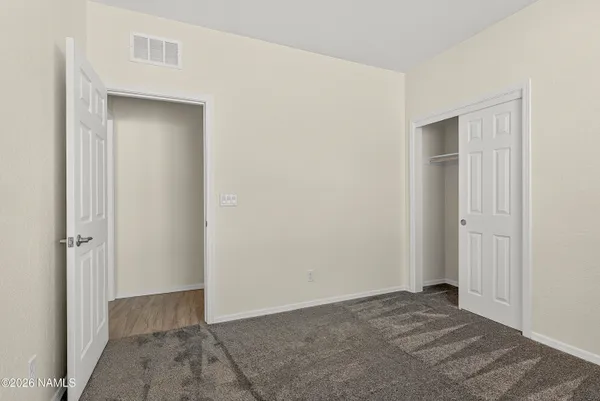 a bathroom with a granite countertop sink a mirror and a vanity
