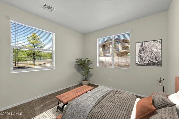 a kitchen with stainless steel appliances granite countertop a stove top oven a sink dishwasher and a refrigerator with wooden floor