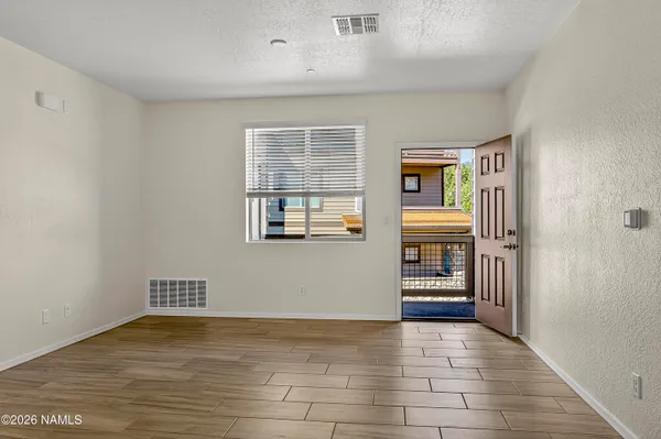 a view of an empty room with a window