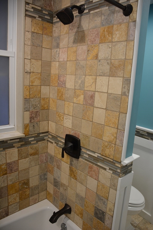 54 Dwight Street, Unit 3 Brookline, MA 02446 - Photo 6 of 16 a bathroom with a shower and a toilet