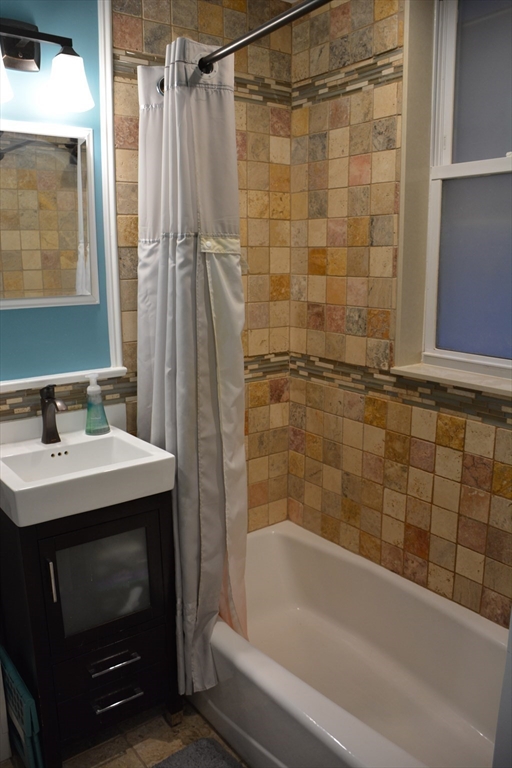 54 Dwight Street, Unit 3 Brookline, MA 02446 - Photo 8 of 16 a bathroom with a sink and a bathtub
