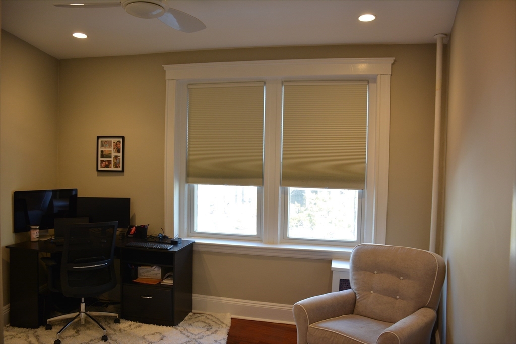 54 Dwight Street, Unit 3 Brookline, MA 02446 - Photo 9 of 16 a living room with furniture and a window