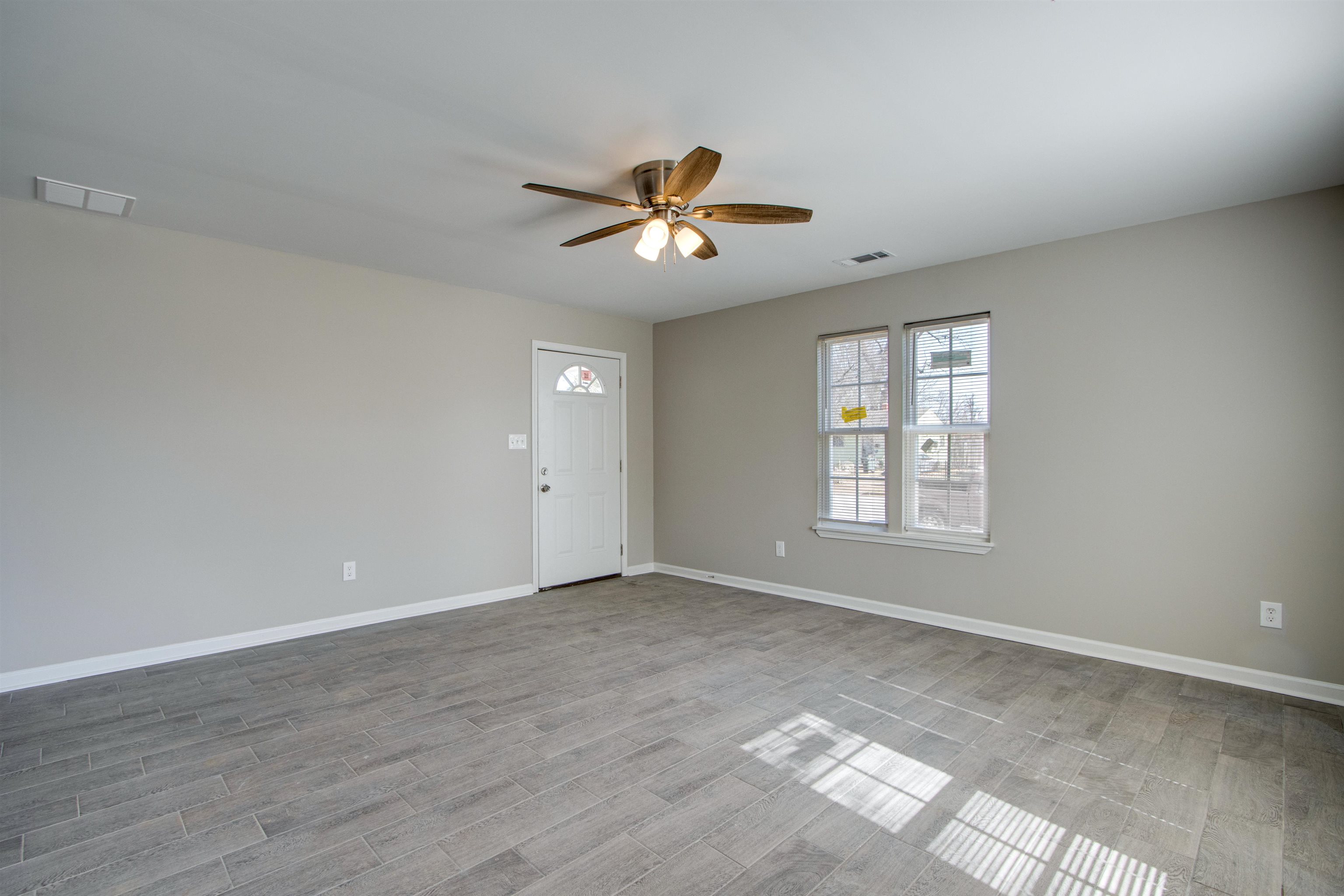3479 Rochester Road Memphis, TN 38109 - Photo 12 of 12 a view of an empty room with a window