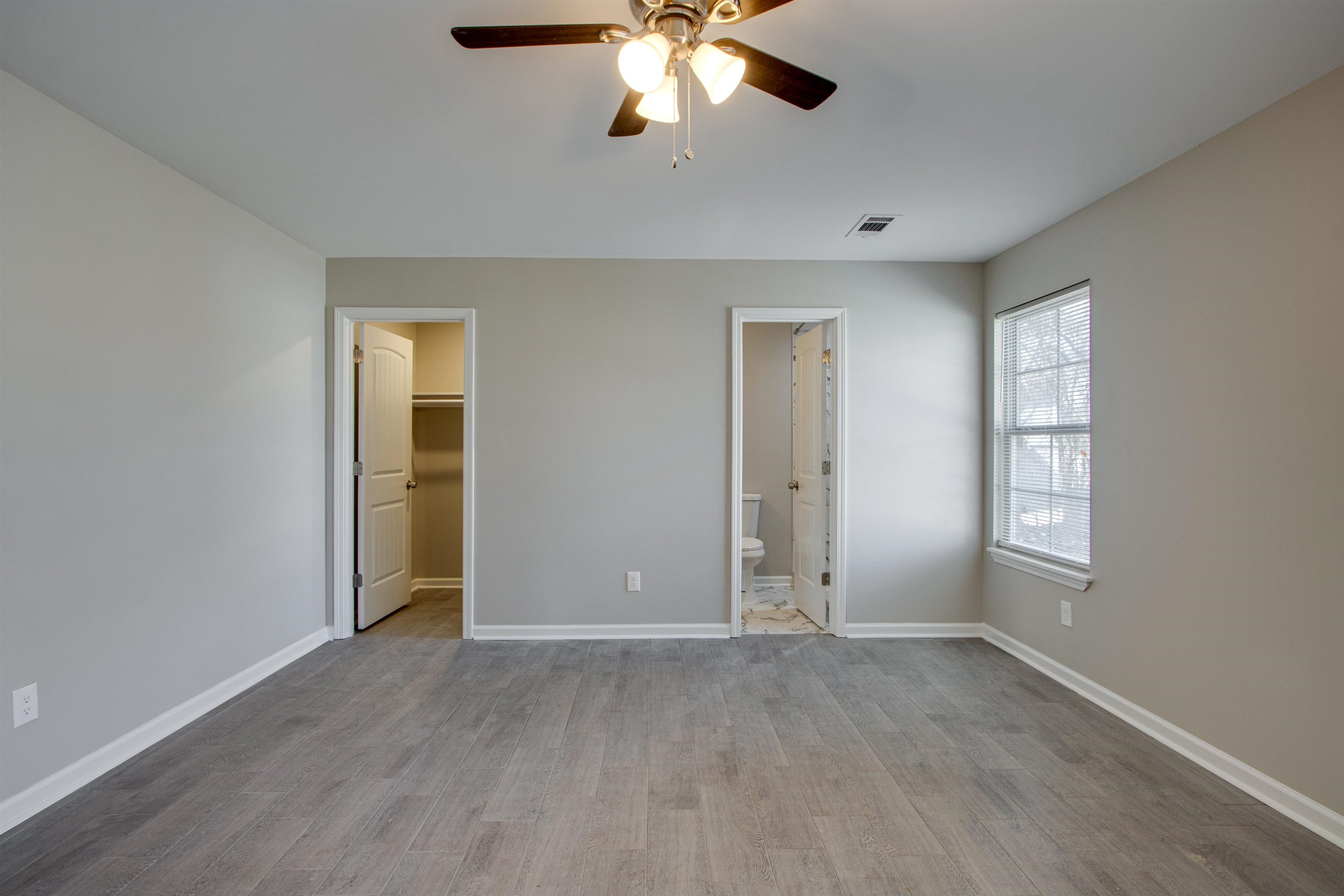 3479 Rochester Road Memphis, TN 38109 - Photo 7 of 12 an empty room with closet and windows