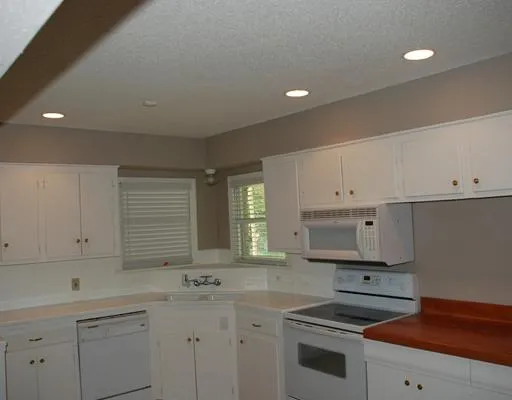 a kitchen that has a sink and a stove