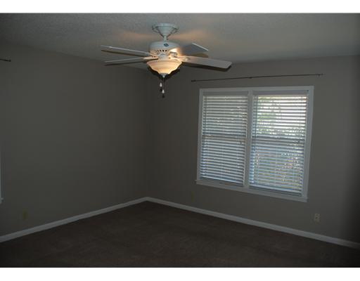 3526 Santa Fe Street Corpus Christi, TX 78411 - Photo 4 of 5 a view of wooden floor and a chandelier in a room