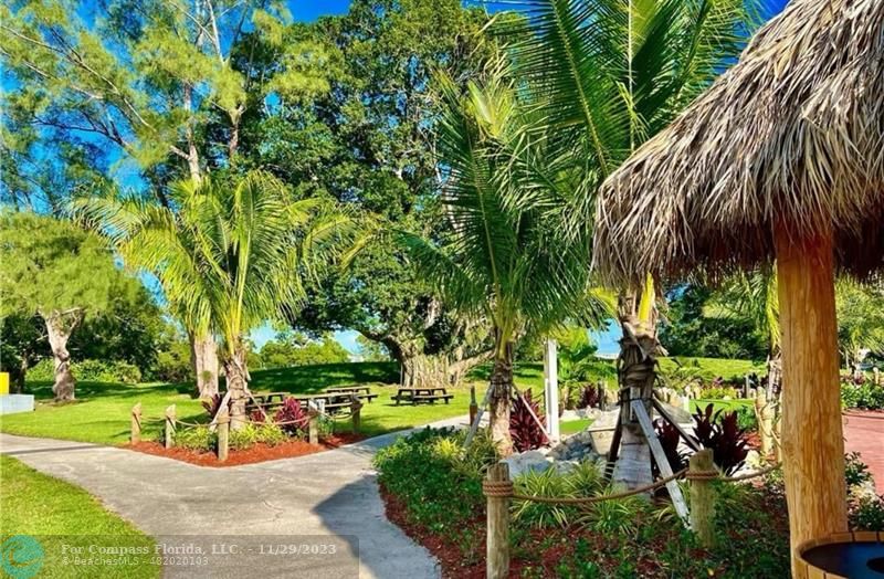 182 Ventnor L, Unit 182 Deerfield Beach, FL 33442 - Photo 25 of 28 a view of a garden with plants