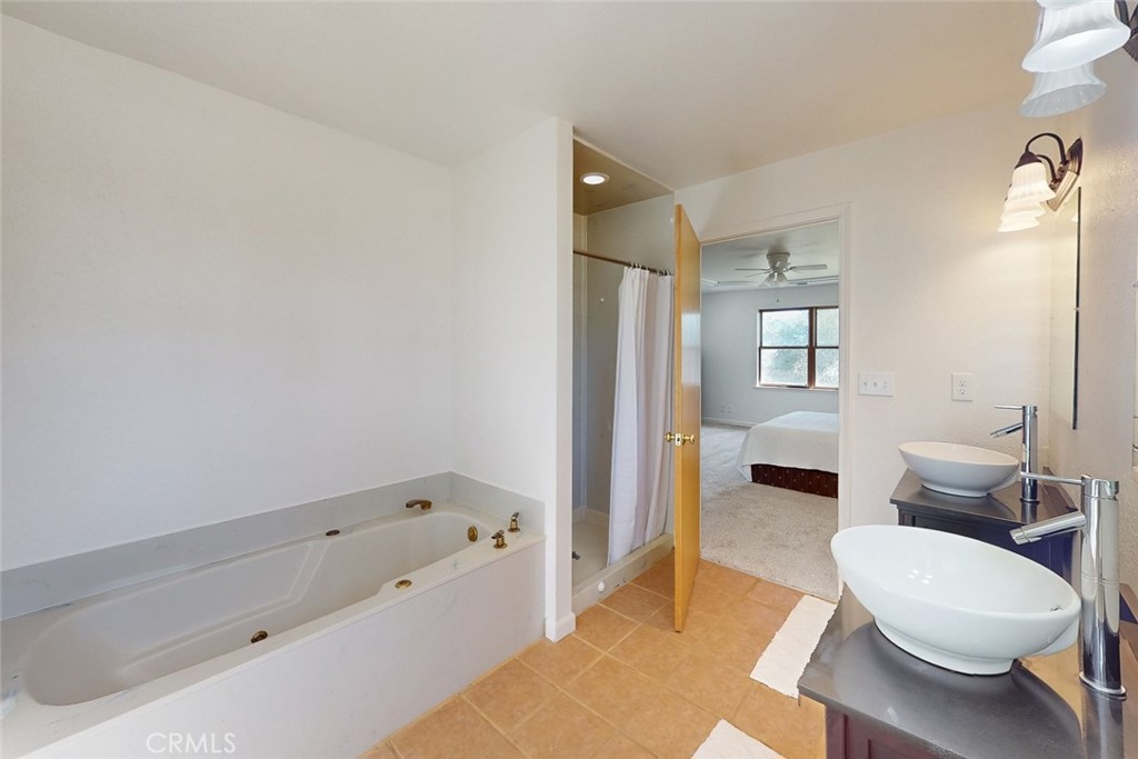 1718 Robinson Mill Road Bangor, CA 95914 - Photo 24 of 74 a bathroom with a tub and a toilet