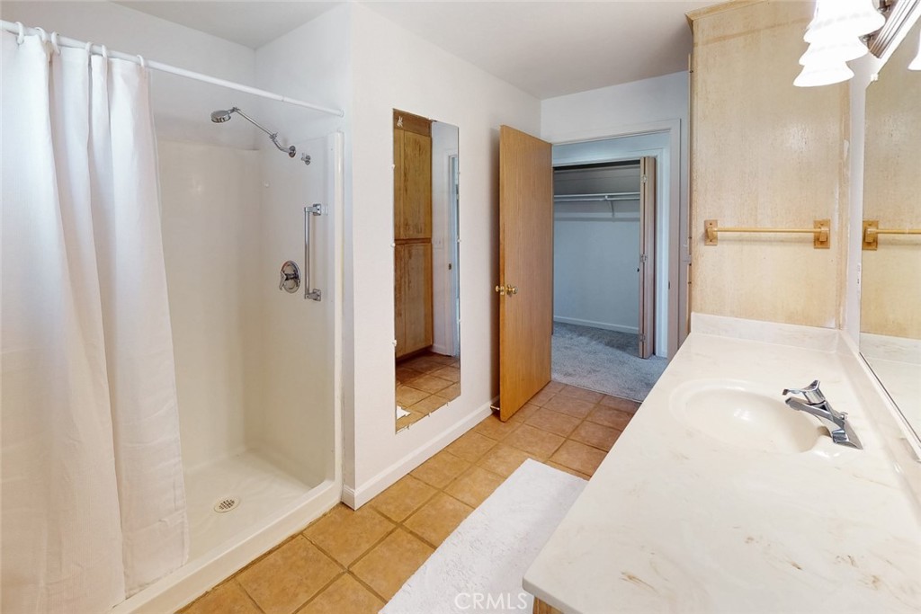1718 Robinson Mill Road Bangor, CA 95914 - Photo 30 of 74 a bathroom with a shower and a glass door