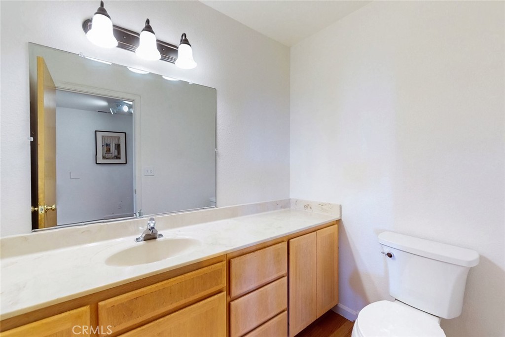 1718 Robinson Mill Road Bangor, CA 95914 - Photo 32 of 74 a bathroom with a toilet sink and mirror