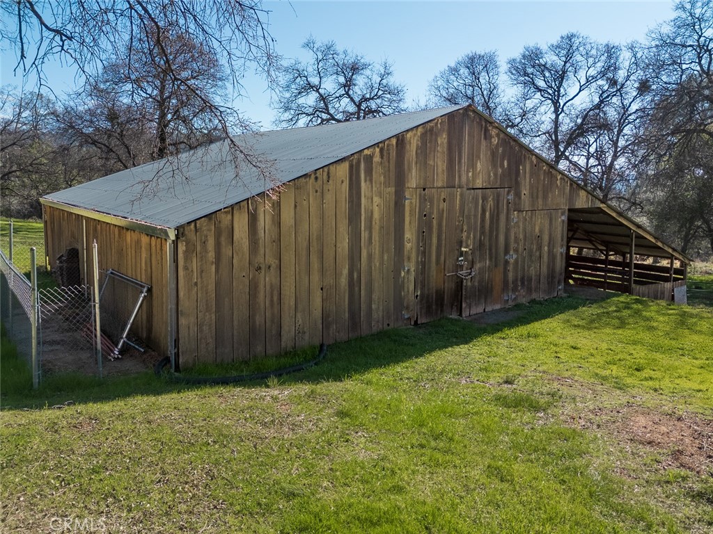 1718 Robinson Mill Road Bangor, CA 95914 - Photo 56 of 74 a backyard of a house with wooden fence