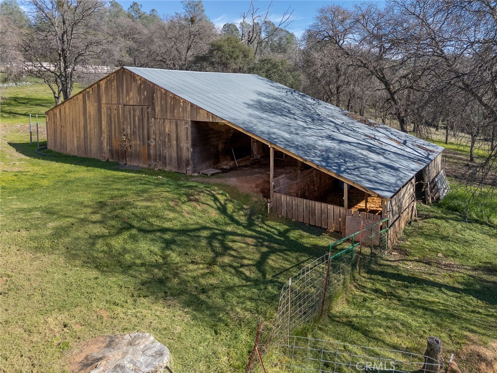 1718 Robinson Mill Road Bangor, CA 95914 - Photo 57 of 74 a view of a wooden fence under a large tree