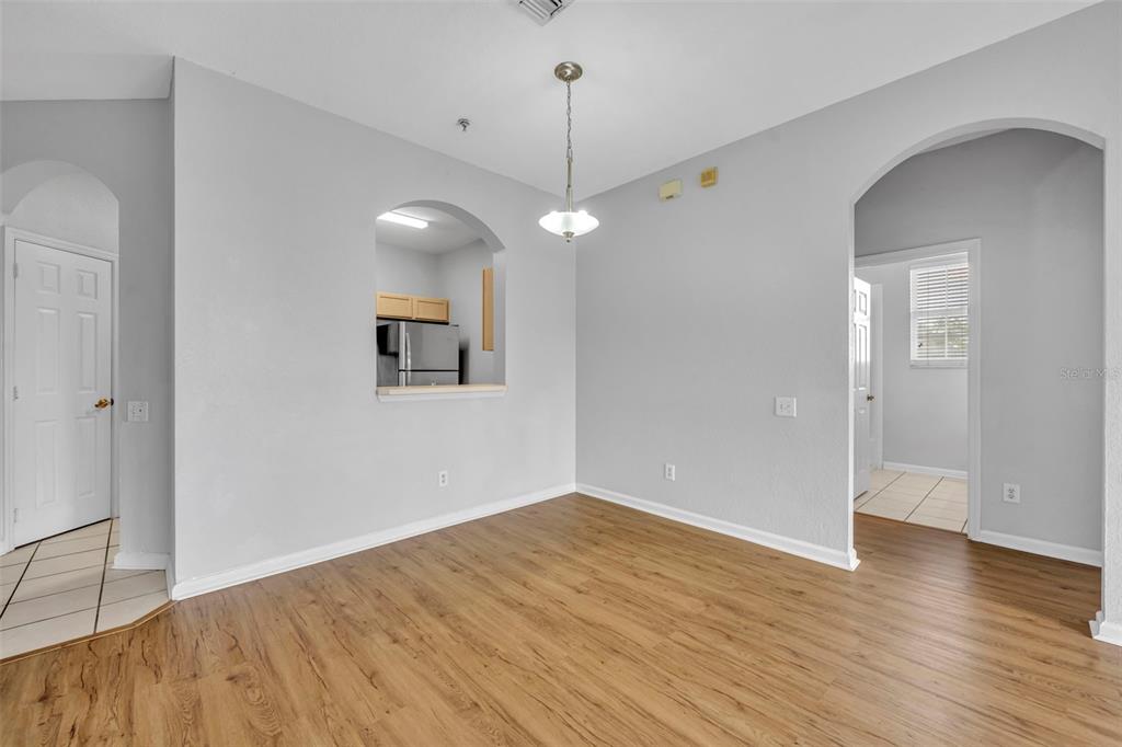 582 Brantley Terrace Way, Unit 304 Altamonte Springs, FL 32714 - Photo 10 of 30 an empty room with wooden floor and windows