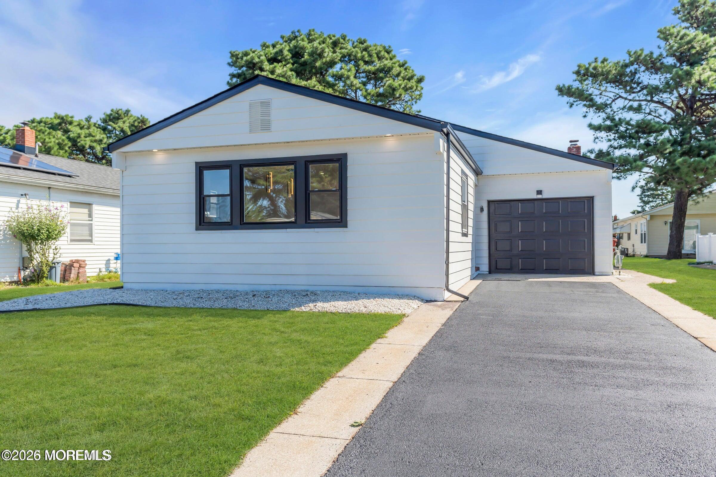 a view of a yard in front view of a house