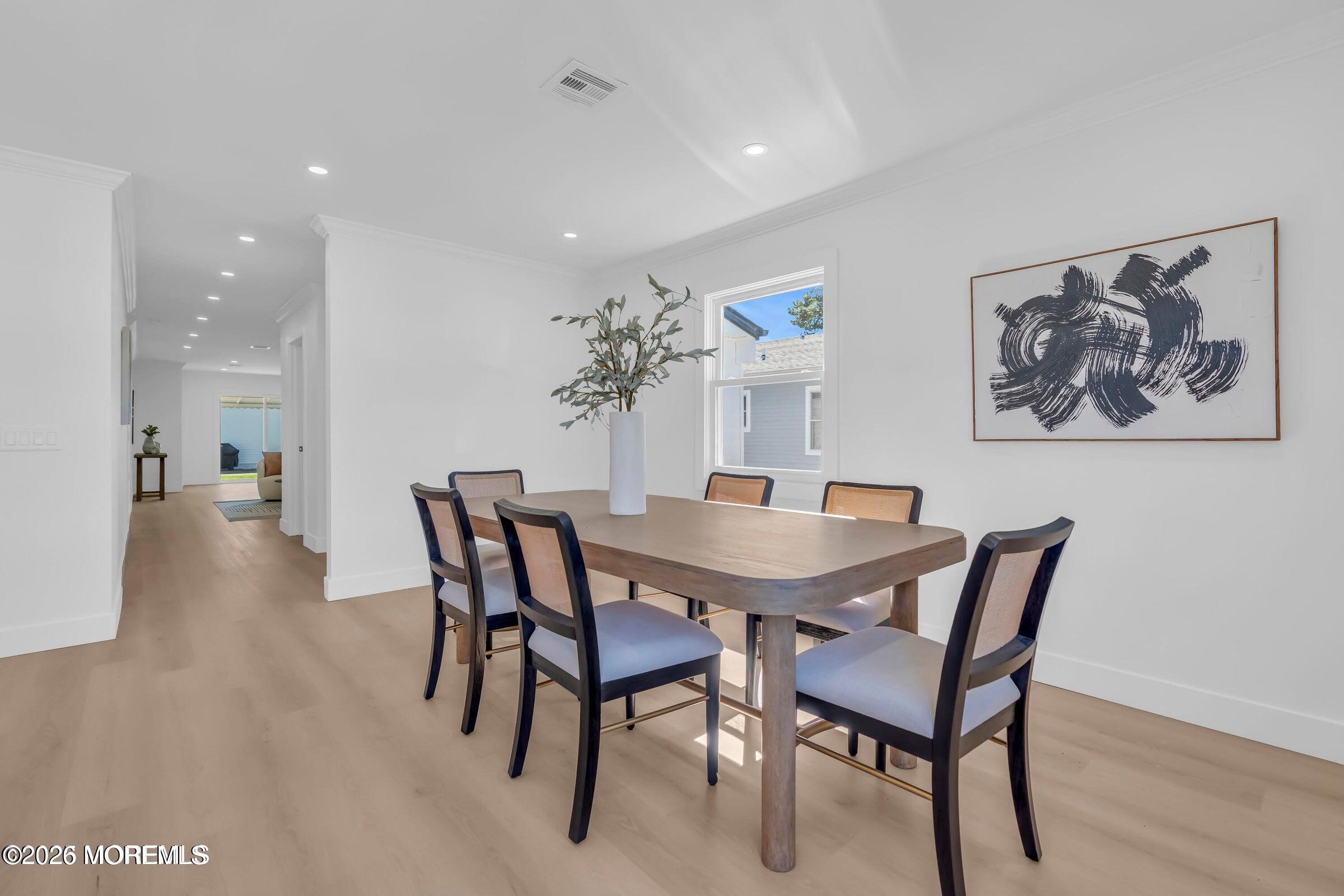 143 Davenport Road Toms River, NJ 08757 - Photo 18 of 41 a view of a dining room with furniture and wooden floor