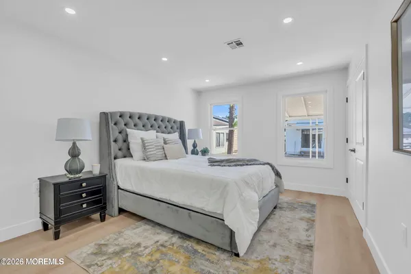 a bedroom with bed and window