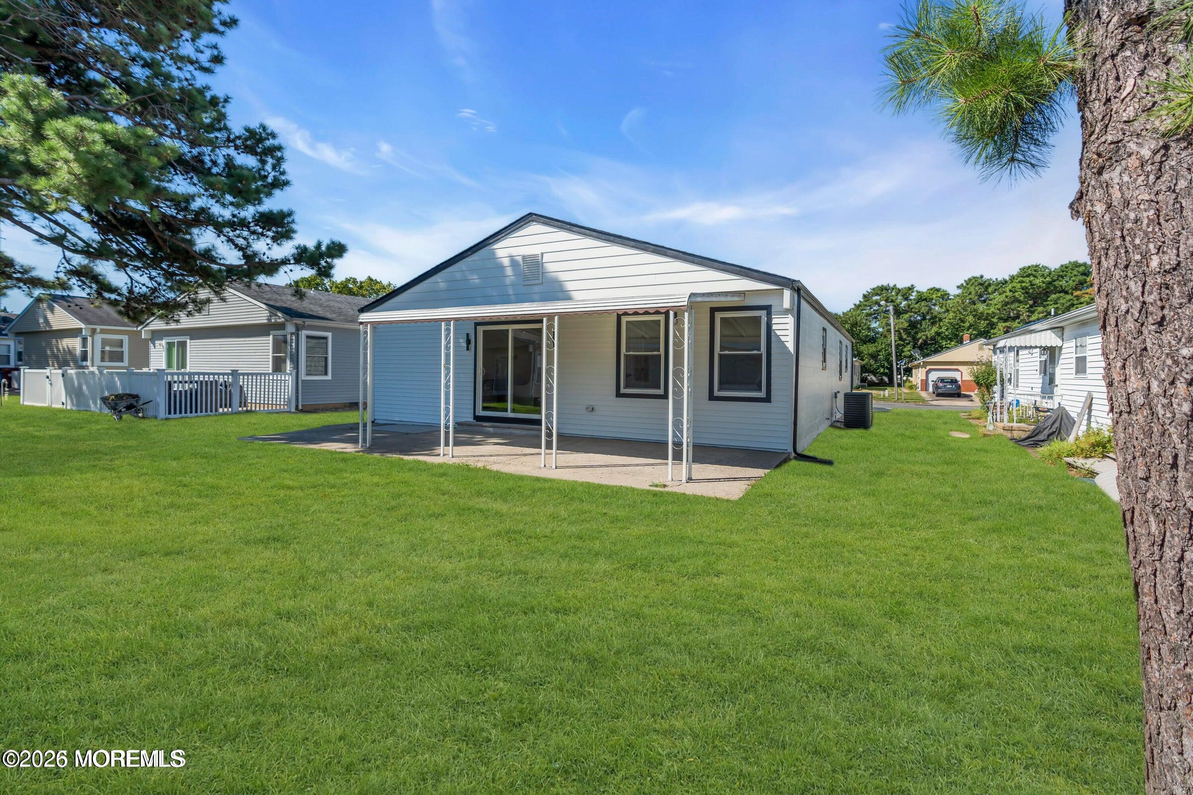 143 Davenport Road Toms River, NJ 08757 - Photo 37 of 41 a view of a house with a backyard