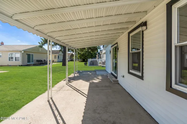 a view of a patio with a backyard