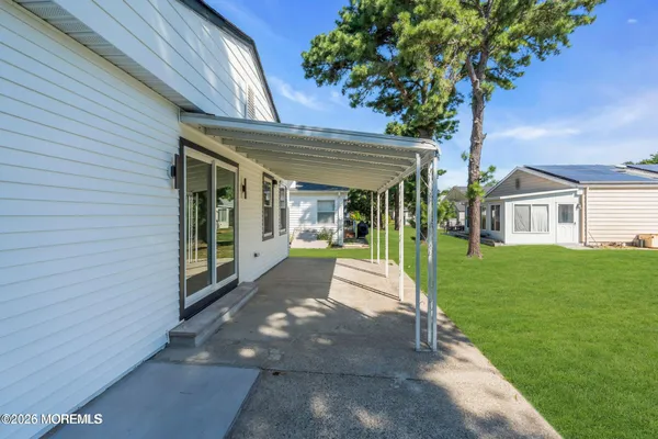 a view of house with a yard