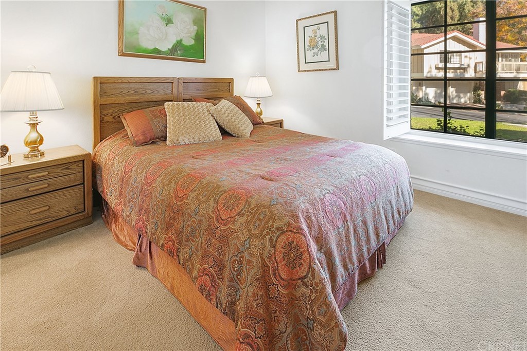 425 Cresthill Drive Oak Park, CA 91377 - Photo 10 of 18 a bed sitting in a bedroom next to a window