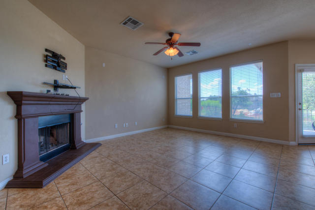 321 Limestone Trail Austin, TX 78737 - Photo 4 of 28 a view of an empty room with a fireplace and a window